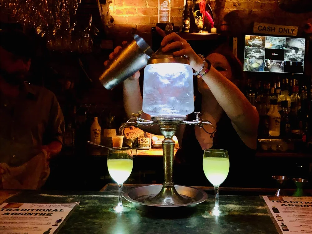 Bartender in New Orleans Serving an Exotic Drink